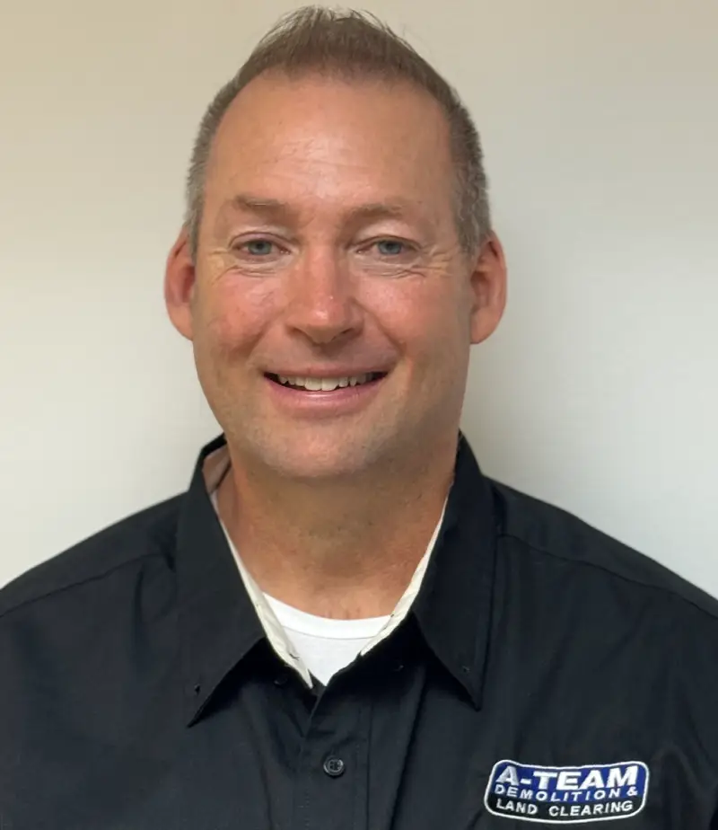 A smiling man with a beard and an A-Team shirt.
