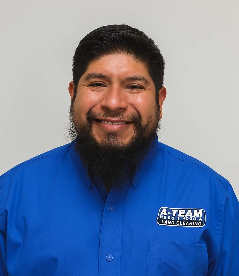 A man with glasses, a goatee, and a striped tie.